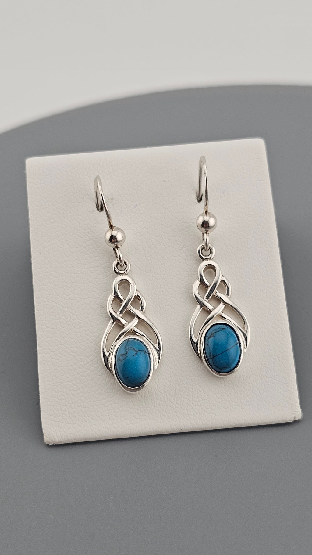 Sterling Silver Celtic Knot Drop Earrings with Turquoise stones.