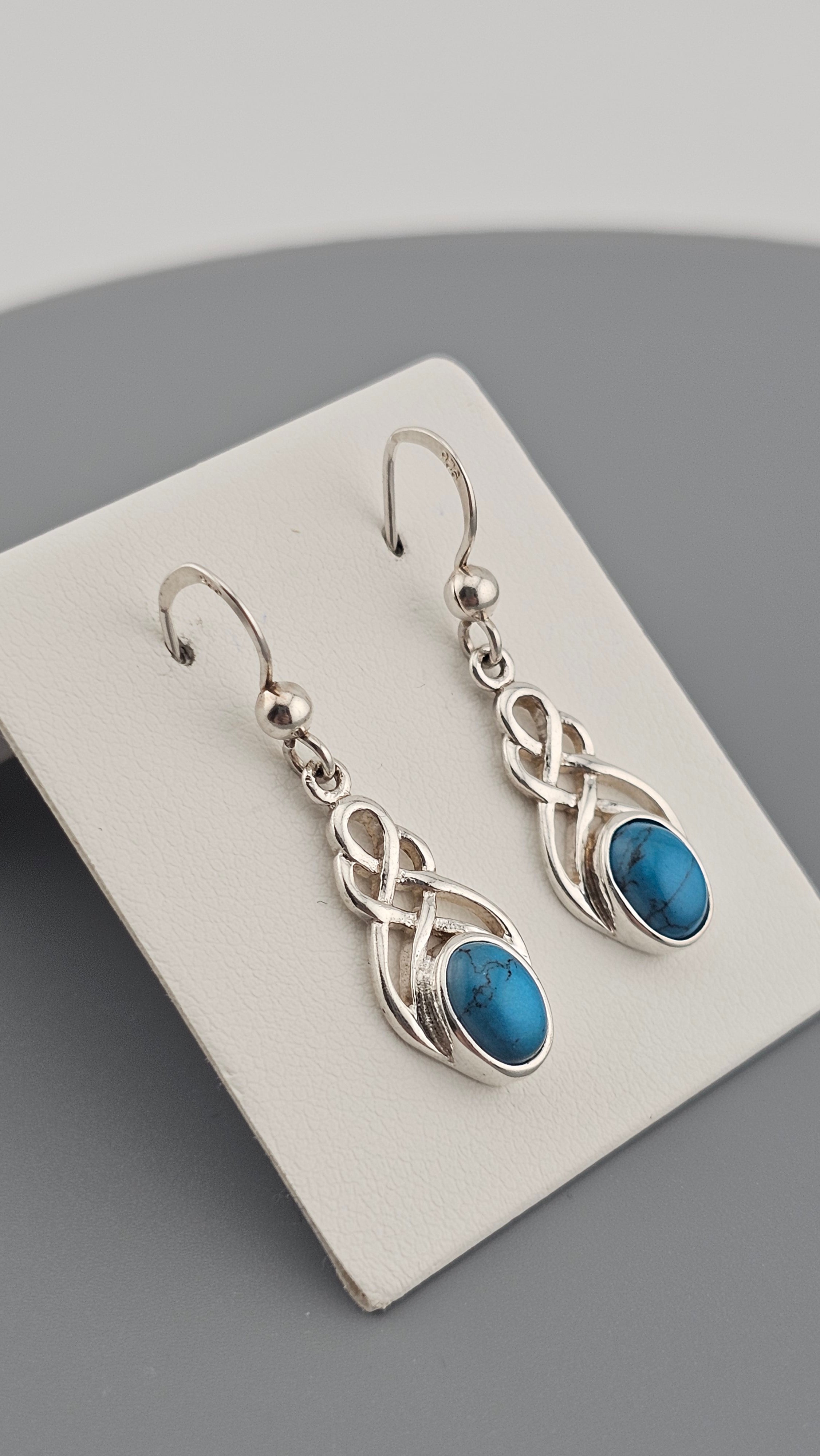 Sterling Silver Celtic Knot Drop Earrings with Turquoise stones.