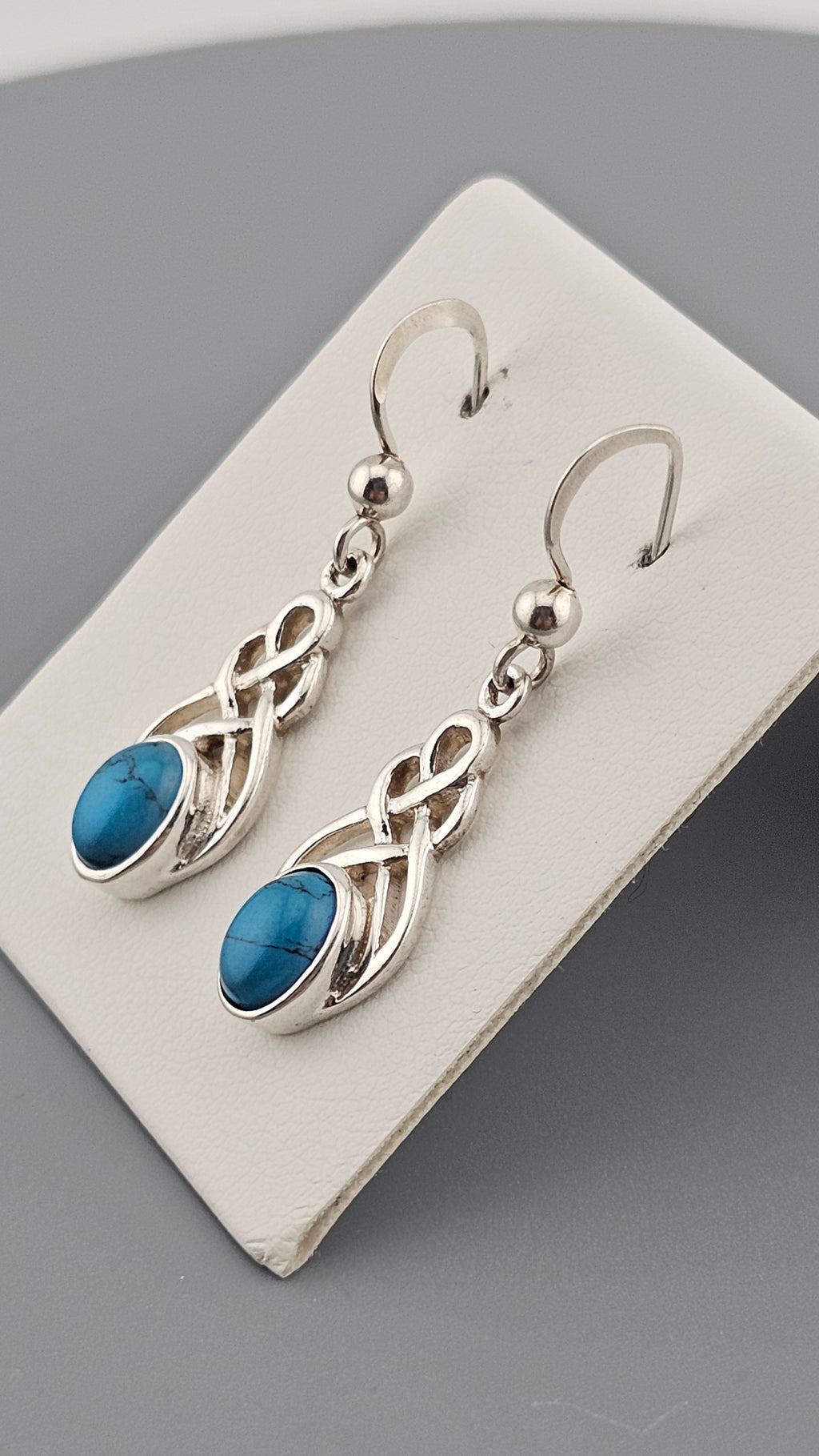 Sterling Silver Celtic Knot Drop Earrings with Turquoise stones.