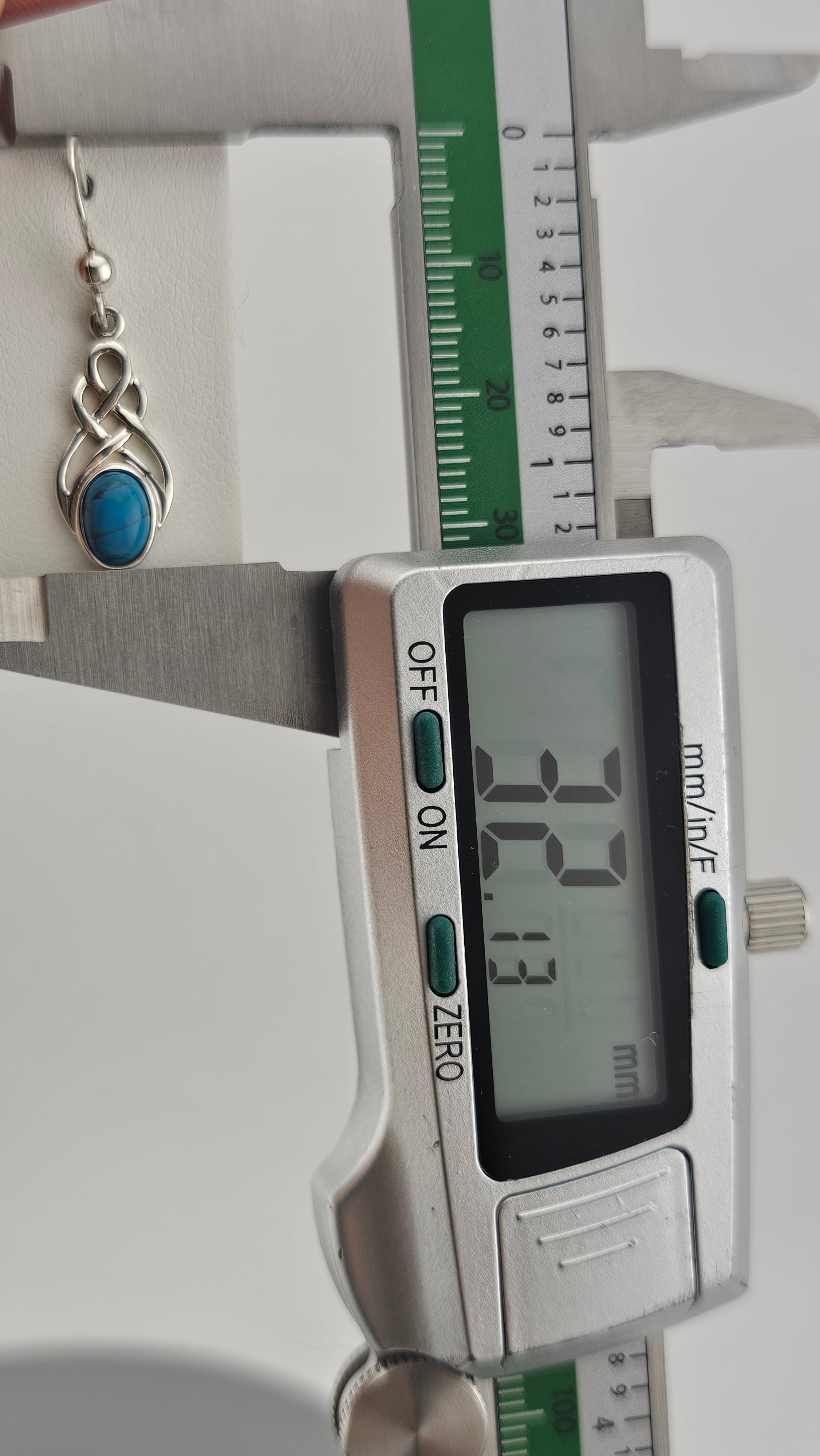 Sterling Silver Celtic Knot Drop Earrings with Turquoise stones.