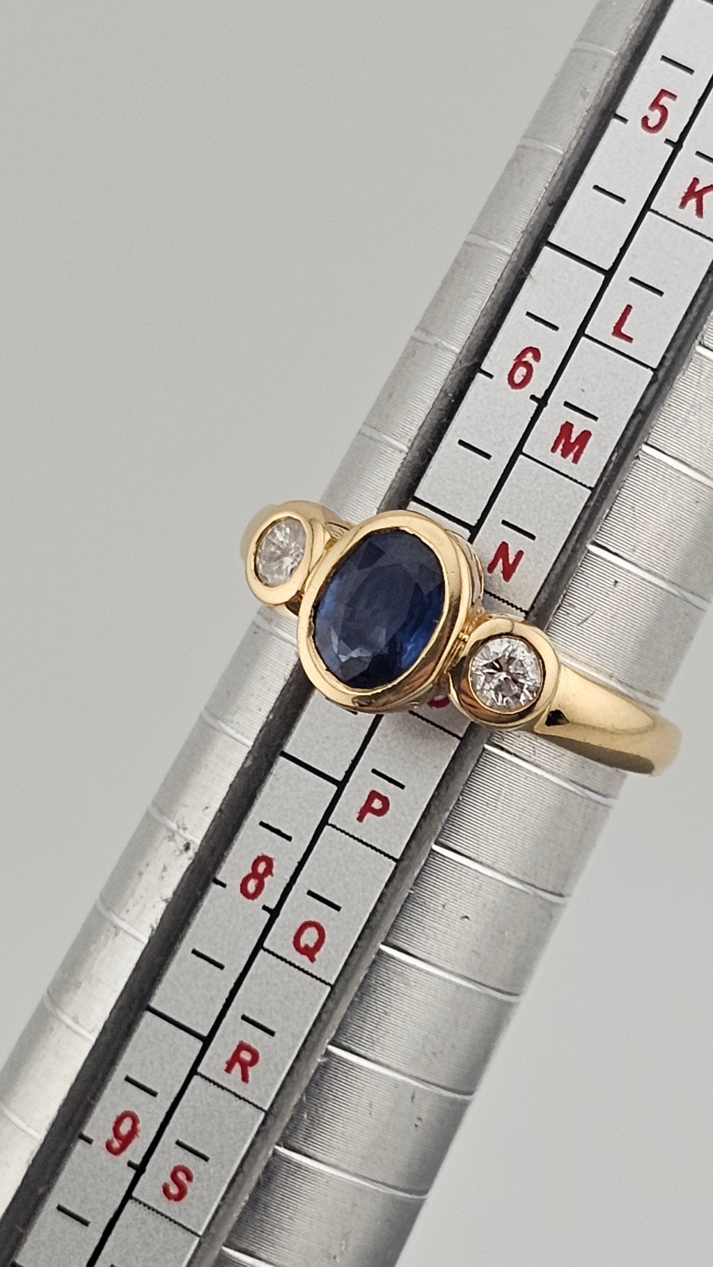 Bezel set 0.85ct Natural Sapphire and 0.20ct Natural Diamonds in 18ct Yellow Gold ring