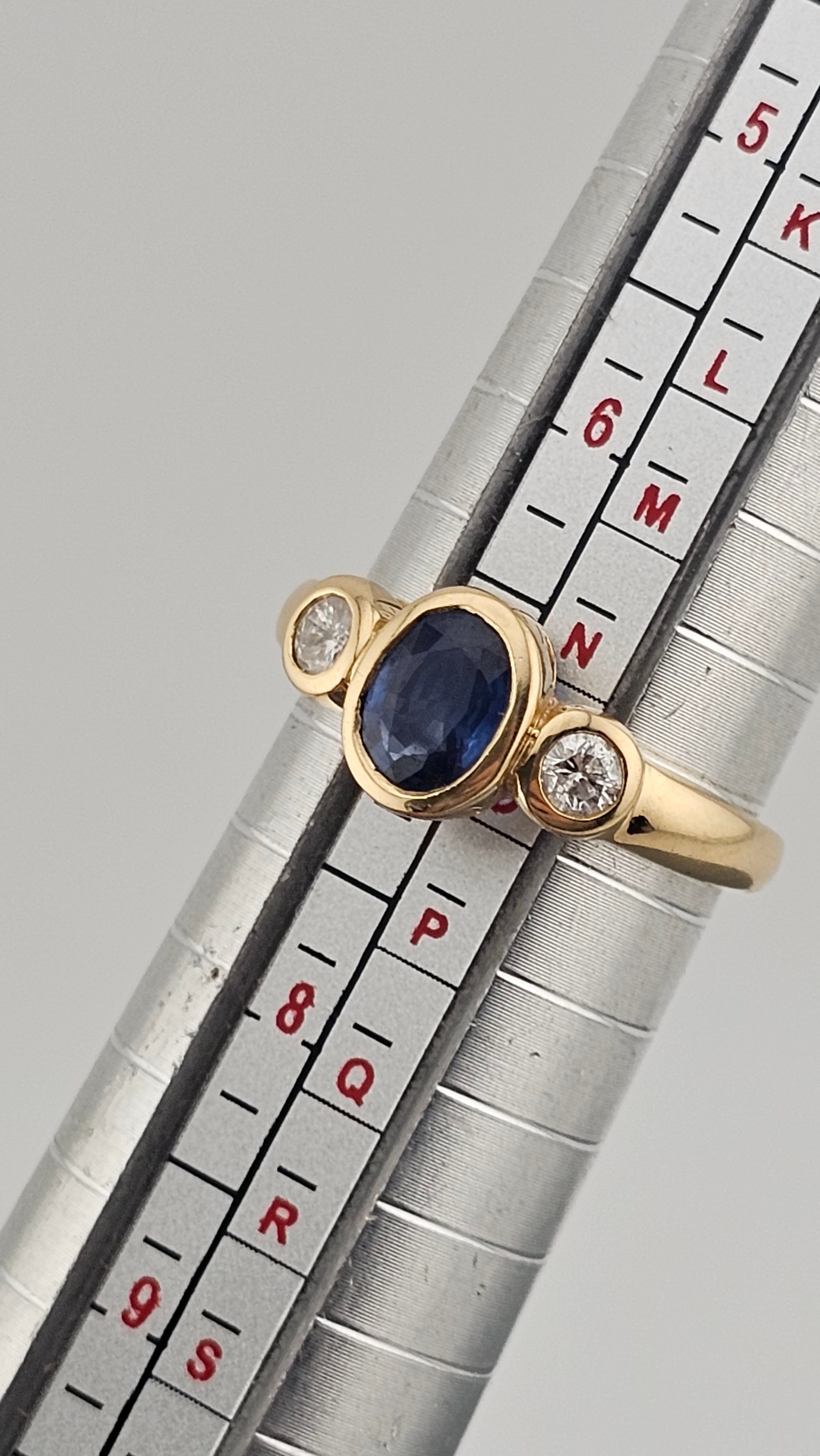 Bezel set 0.85ct Natural Sapphire and 0.20ct Natural Diamonds in 18ct Yellow Gold ring
