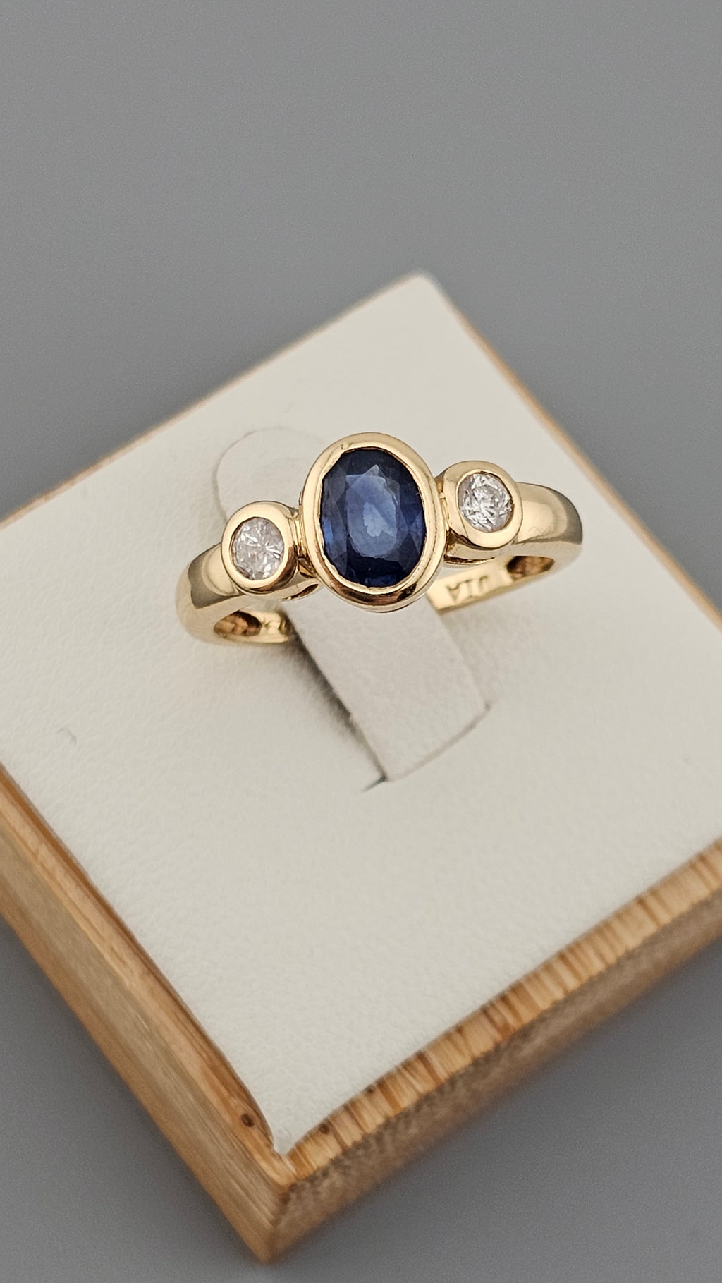 Bezel set 0.85ct Natural Sapphire and 0.20ct Natural Diamonds in 18ct Yellow Gold ring