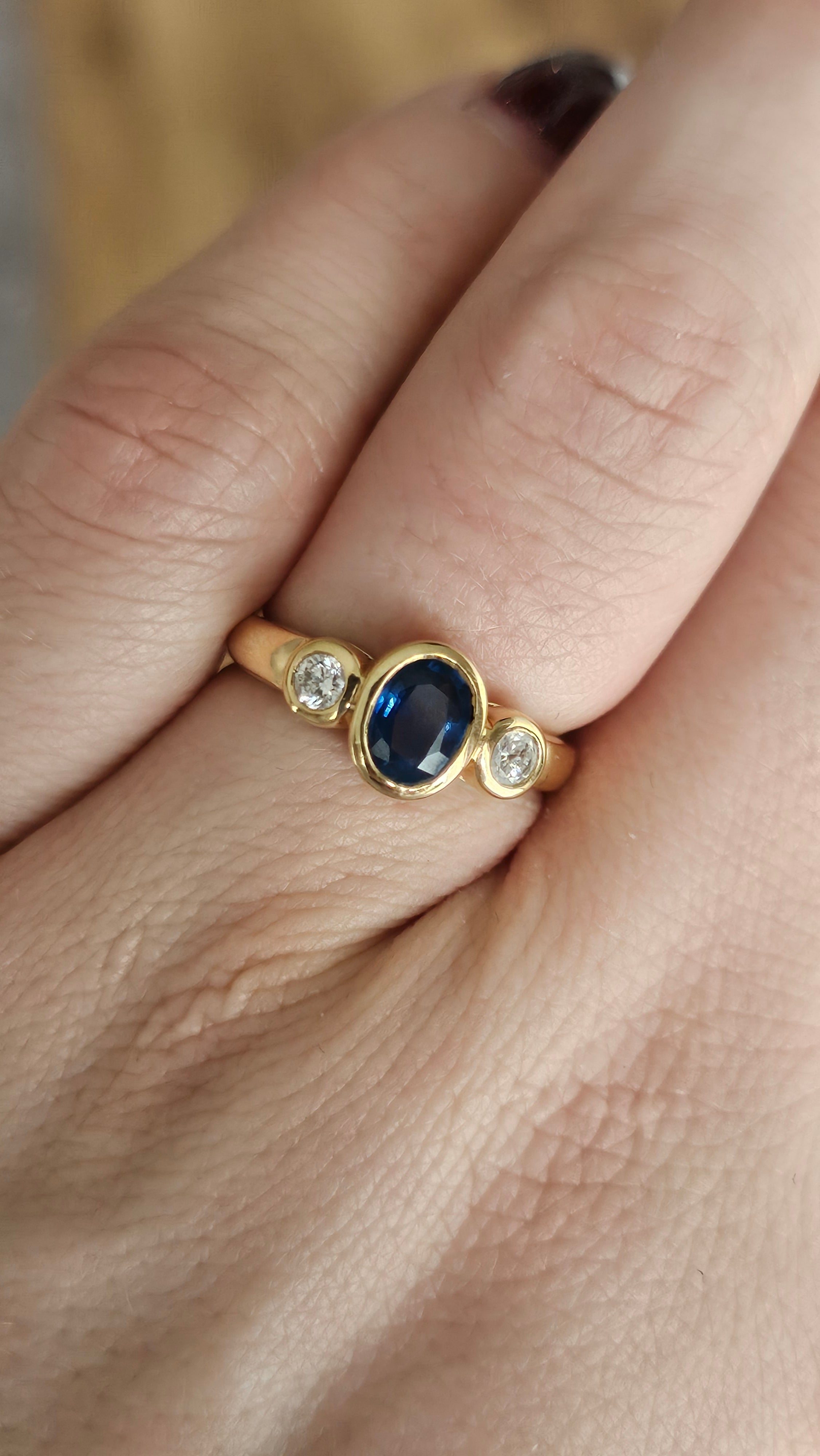 Bezel set 0.85ct Natural Sapphire and 0.20ct Natural Diamonds in 18ct Yellow Gold ring